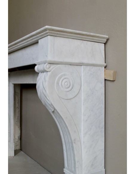 Antique marble mantel carved in white marble, with lion's paw details. This fireplace is original, authentic, a unique piece.