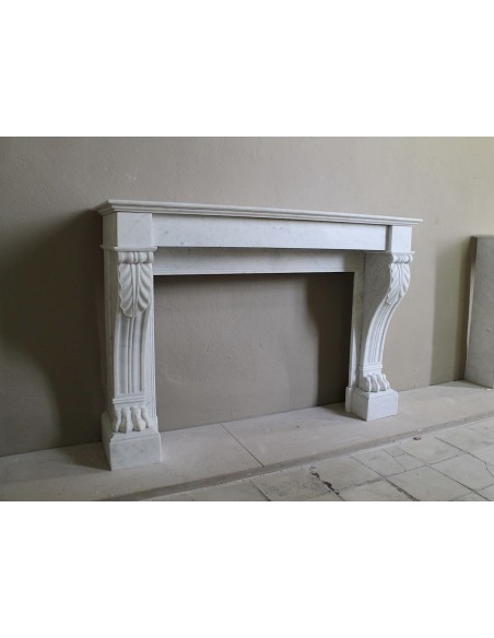 Antique marble mantel carved in white marble, with lion's paw details. This fireplace is original, authentic, a unique piece.