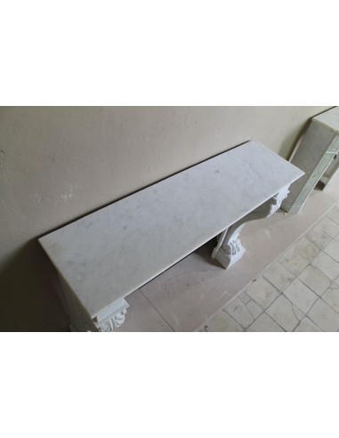 Antique marble mantel carved in white marble, with lion's paw details. This fireplace is original, authentic, a unique piece.