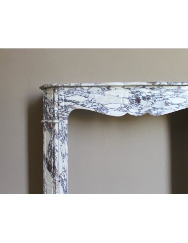 Small antique Baroque fireplace carved in very rare and famous Breccia Violetta marble, an elegant and colorful marble.