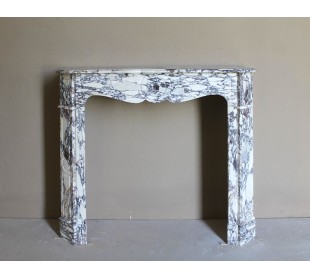 Small antique Baroque fireplace carved in very rare and famous Breccia Violetta marble, an elegant and colorful marble.