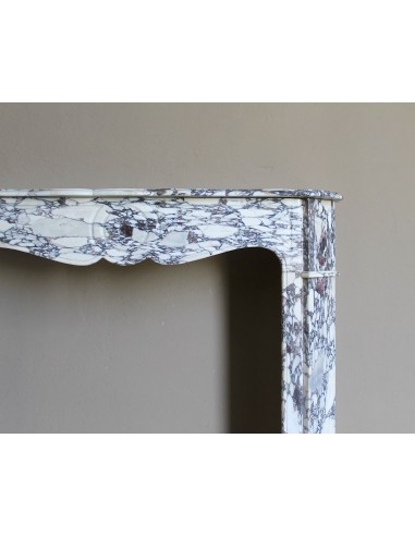 Small antique Baroque fireplace carved in very rare and famous Breccia Violetta marble, an elegant and colorful marble.