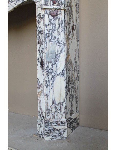 Small antique Baroque fireplace carved in very rare and famous Breccia Violetta marble, an elegant and colorful marble.