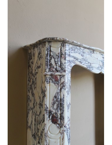 Small antique Baroque fireplace carved in very rare and famous Breccia Violetta marble, an elegant and colorful marble.