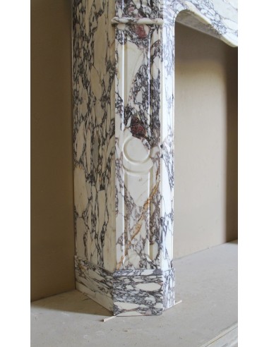 Small antique Baroque fireplace carved in very rare and famous Breccia Violetta marble, an elegant and colorful marble.