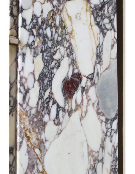Small antique Baroque fireplace carved in very rare and famous Breccia Violetta marble, an elegant and colorful marble.