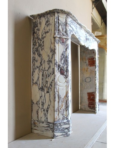 Small antique Baroque fireplace carved in very rare and famous Breccia Violetta marble, an elegant and colorful marble.