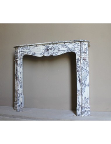 Small antique Baroque fireplace carved in very rare and famous Breccia Violetta marble, an elegant and colorful marble.