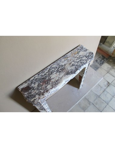 Small antique Baroque fireplace carved in very rare and famous Breccia Violetta marble, an elegant and colorful marble.