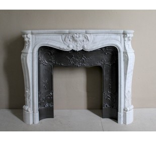 Floral Louis XV fireplace mantel carved in white marble, with shell decorations, complete with its original cast iron insert.