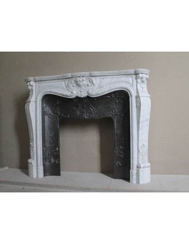 Floral Louis XV fireplace mantel carved in white marble, with shell decorations, complete with its original cast iron insert.