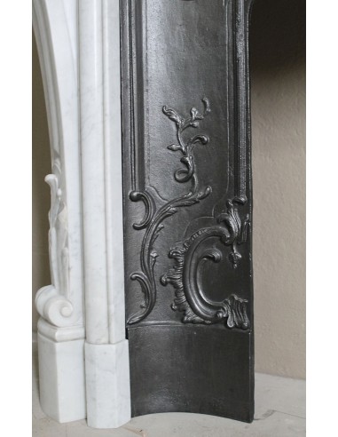 Floral Louis XV fireplace mantel carved in white marble, with shell decorations, complete with its original cast iron insert.