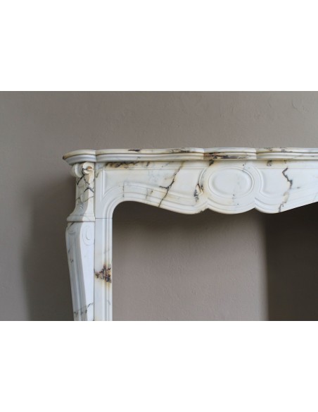 Antique Louis XV Pied Galbé mantelpiece in Paonazzetto marble. This is a highly refined mantelpiece in a stunning marble.