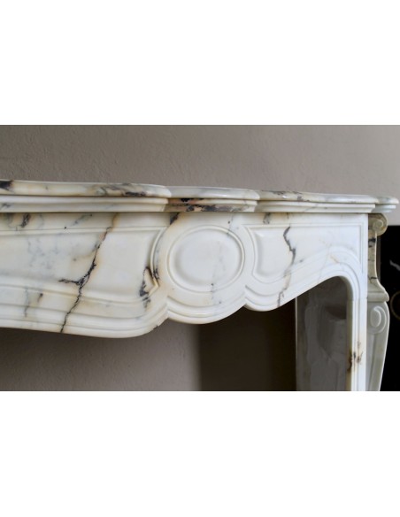Antique Louis XV Pied Galbé mantelpiece in Paonazzetto marble. This is a highly refined mantelpiece in a stunning marble.