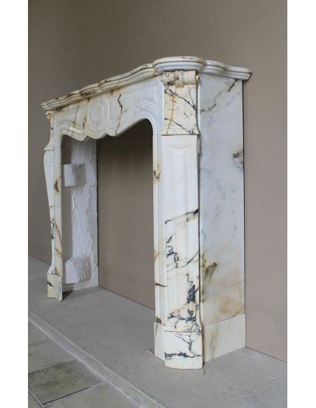 Antique Louis XV Pied Galbé mantelpiece in Paonazzetto marble. This is a highly refined mantelpiece in a stunning marble.