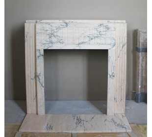 Art Deco mantel carved in veined pink marble called Rosa Portogallo. This antique fireplace comes with its original base.