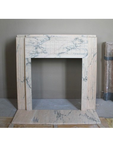 Art Deco mantel carved in veined pink marble called Rosa Portogallo. This antique fireplace comes with its original base.