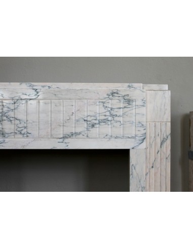 Art Deco mantel carved in veined pink marble called Rosa Portogallo. This antique fireplace comes with its original base.