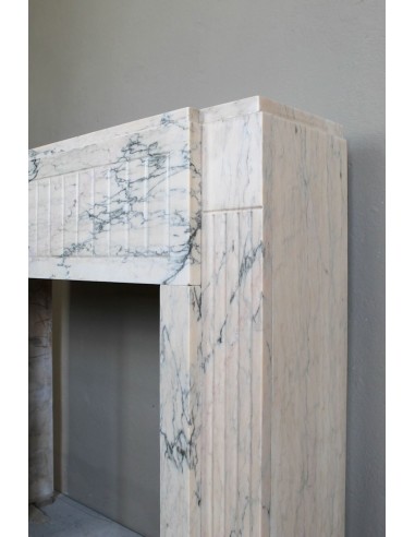 Art Deco mantel carved in veined pink marble called Rosa Portogallo. This antique fireplace comes with its original base.