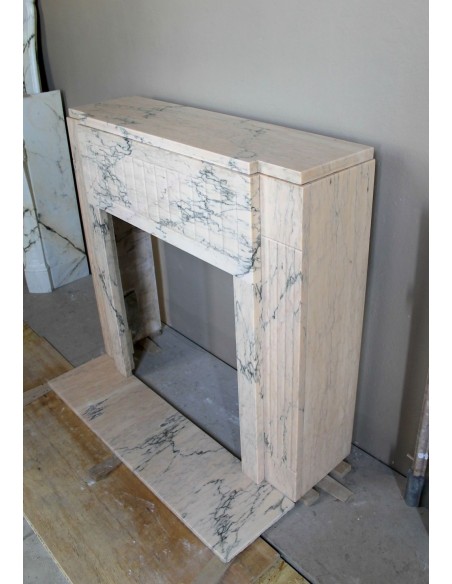 Art Deco mantel carved in veined pink marble called Rosa Portogallo. This antique fireplace comes with its original base.