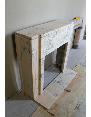 Art Deco mantel carved in veined pink marble called Rosa Portogallo. This antique fireplace comes with its original base.