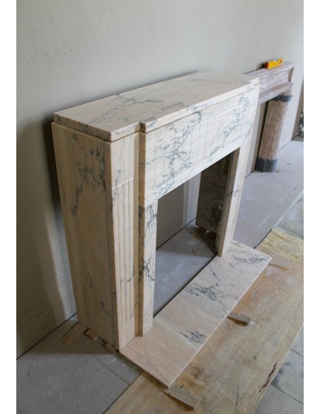 Art Deco mantel carved in veined pink marble called Rosa Portogallo. This antique fireplace comes with its original base.