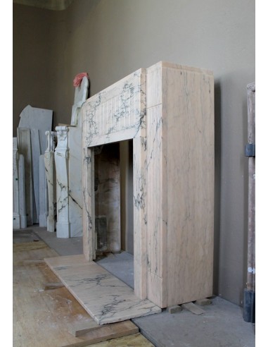 Art Deco mantel carved in veined pink marble called Rosa Portogallo. This antique fireplace comes with its original base.