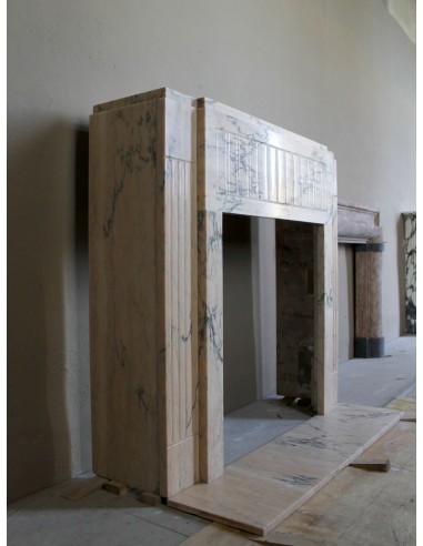 Art Deco mantel carved in veined pink marble called Rosa Portogallo. This antique fireplace comes with its original base.