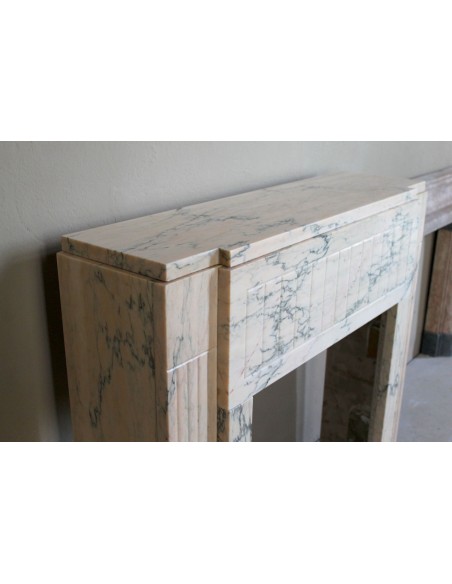 Art Deco mantel carved in veined pink marble called Rosa Portogallo. This antique fireplace comes with its original base.