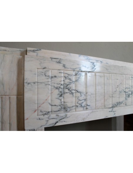 Art Deco mantel carved in veined pink marble called Rosa Portogallo. This antique fireplace comes with its original base.