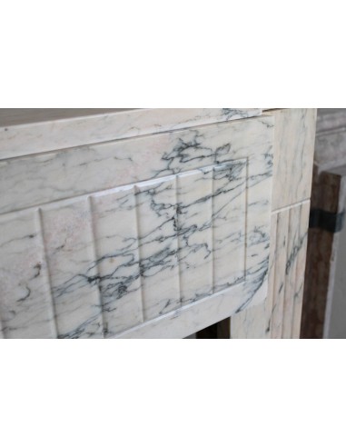 Art Deco mantel carved in veined pink marble called Rosa Portogallo. This antique fireplace comes with its original base.