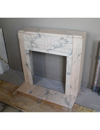 Art Deco mantel carved in veined pink marble called Rosa Portogallo. This antique fireplace comes with its original base.