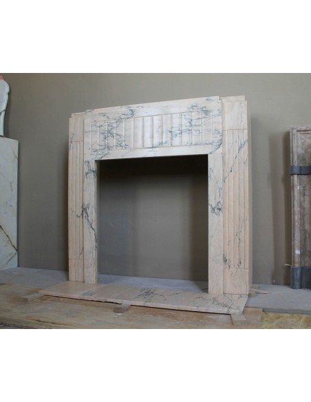 Art Deco mantel carved in veined pink marble called Rosa Portogallo. This antique fireplace comes with its original base.