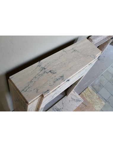 Art Deco mantel carved in veined pink marble called Rosa Portogallo. This antique fireplace comes with its original base.