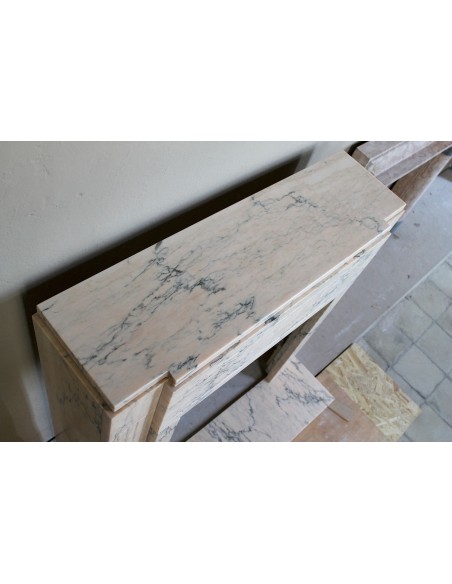 Art Deco mantel carved in veined pink marble called Rosa Portogallo. This antique fireplace comes with its original base.