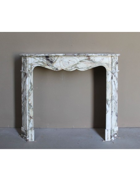 Baroque Pompadour fireplace mantel carved in magnificent Calacatta Gold marble: shades of gold, purple, emerald green, white.