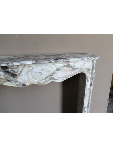 Baroque Pompadour fireplace mantel carved in magnificent Calacatta Gold marble: shades of gold, purple, emerald green, white.