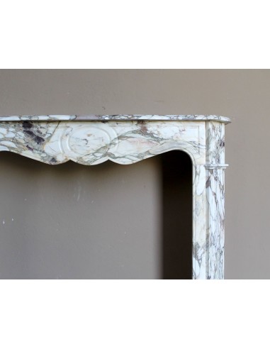 Baroque Pompadour fireplace mantel carved in magnificent Calacatta Gold marble: shades of gold, purple, emerald green, white.