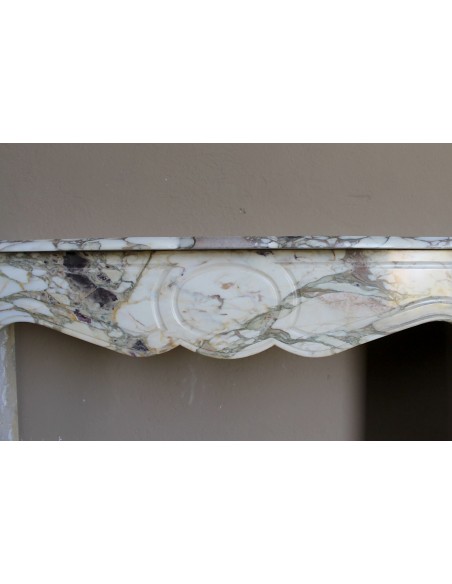 Baroque Pompadour fireplace mantel carved in magnificent Calacatta Gold marble: shades of gold, purple, emerald green, white.