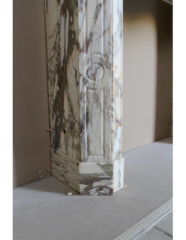 Baroque Pompadour fireplace mantel carved in magnificent Calacatta Gold marble: shades of gold, purple, emerald green, white.