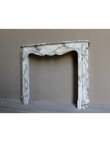 Baroque Pompadour fireplace mantel carved in magnificent Calacatta Gold marble: shades of gold, purple, emerald green, white.