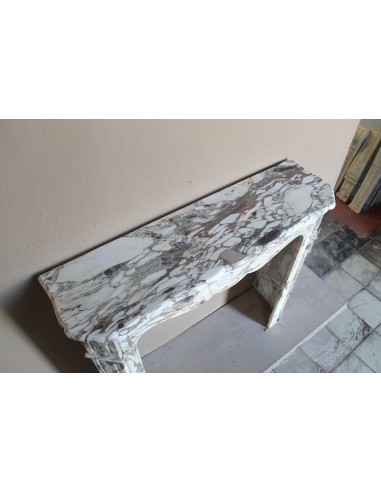 Baroque Pompadour fireplace mantel carved in magnificent Calacatta Gold marble: shades of gold, purple, emerald green, white.