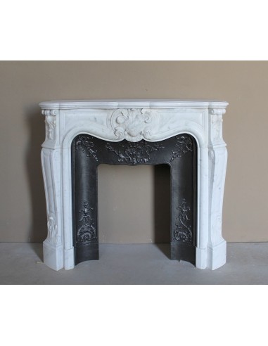 Baroque fireplace mantel in White Carrara marble with floral motifs, complete with decorative cast iron insert.