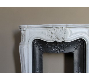 Baroque fireplace mantel in White Carrara marble with floral motifs, complete with decorative cast iron insert. 2