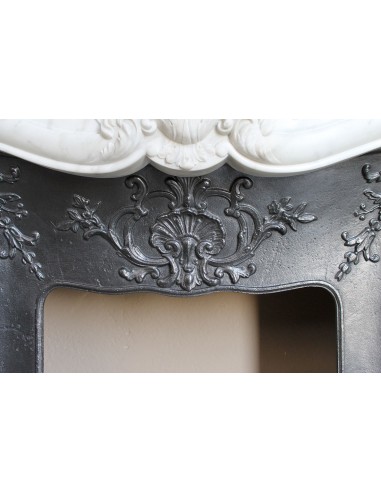 Baroque fireplace mantel in White Carrara marble with floral motifs, complete with decorative cast iron insert.