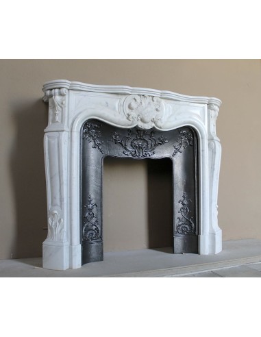 Baroque fireplace mantel in White Carrara marble with floral motifs, complete with decorative cast iron insert.