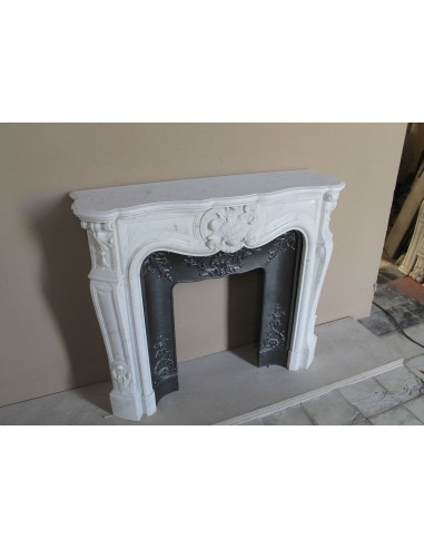 Baroque fireplace mantel in White Carrara marble with floral motifs, complete with decorative cast iron insert.