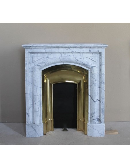 Small "Boudin" fireplace mantel in blue-toned marble with its original gilded brass insert featuring a sliding shutter.