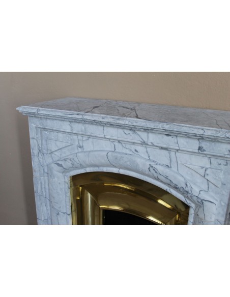 Small "Boudin" fireplace mantel in blue-toned marble with its original gilded brass insert featuring a sliding shutter.