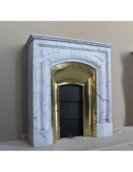 Small "Boudin" fireplace mantel in blue-toned marble with its original gilded brass insert featuring a sliding shutter.
